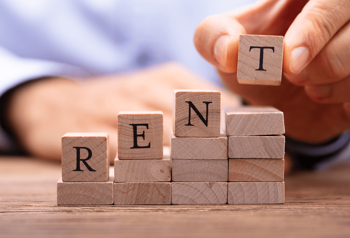 photo: wooden blocks rising to the right with the word "R-E-N-T" spelled out (iStockphoto)