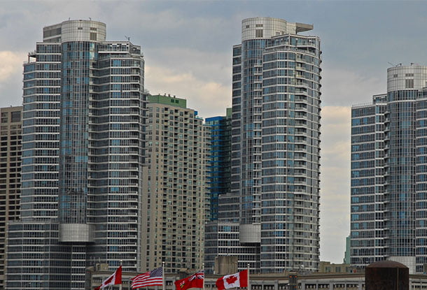 photo: high-rise buildings with flags flying in front (iStockphoto)