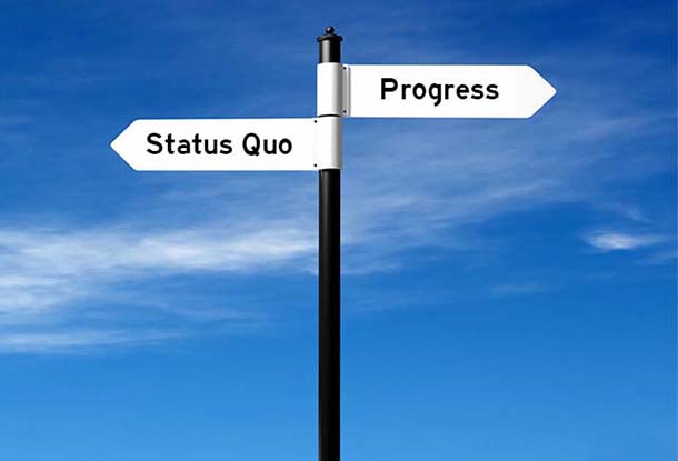 photo composition: opposing signs that read "Status Quo" and "Progress" (Maytree, iStockphoto)