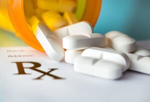 Prescription symbol, bottle and pills (iStockphoto)