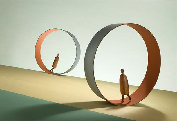 image: wooden figures walking in hoops (iStockphoto)