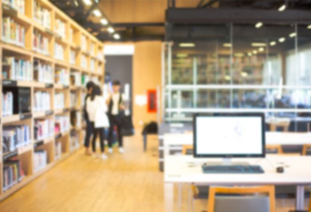 photo: blurred figures in a library setting (iStockphoto)
